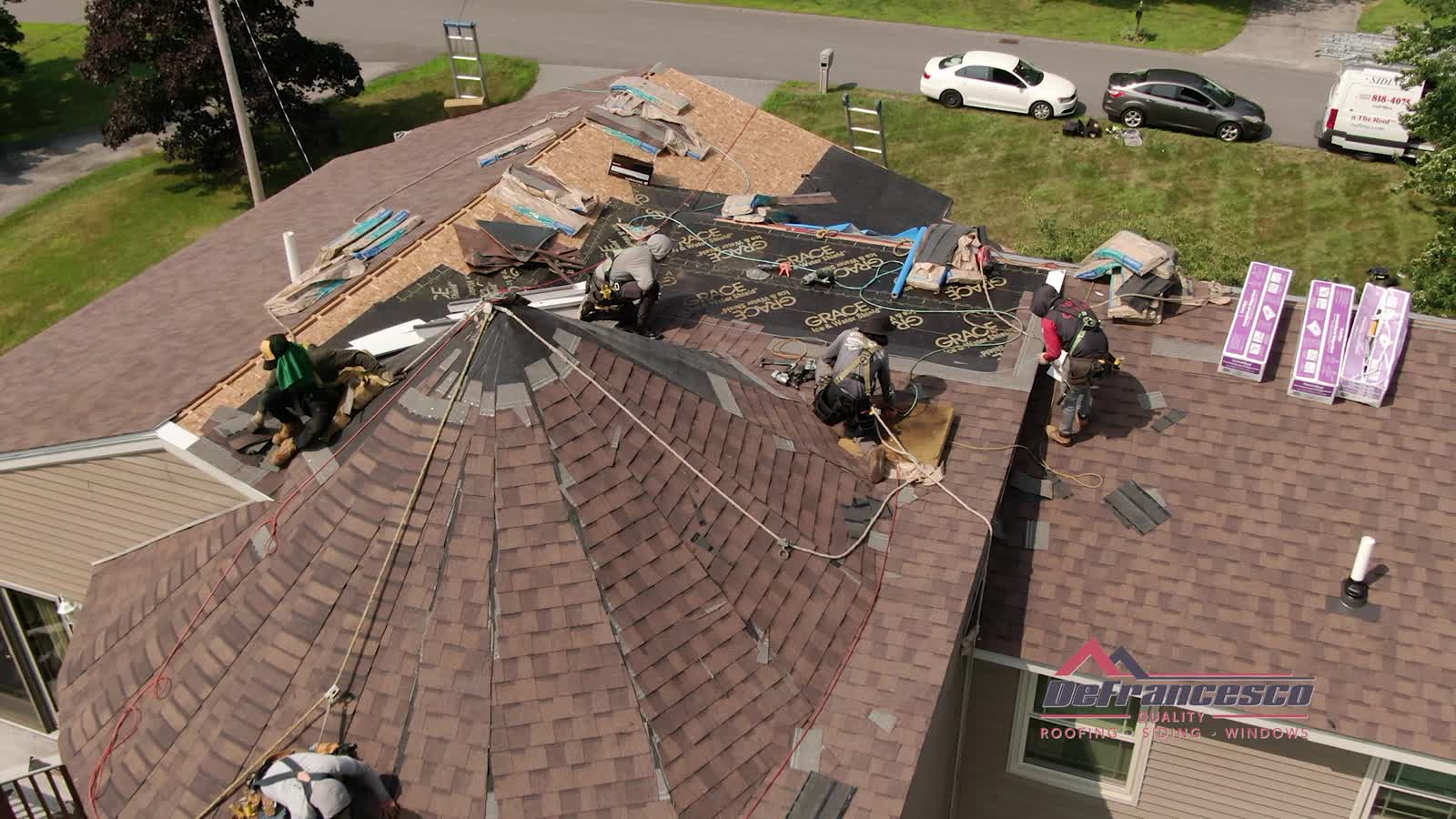 Aerial view of a roofing crew at work