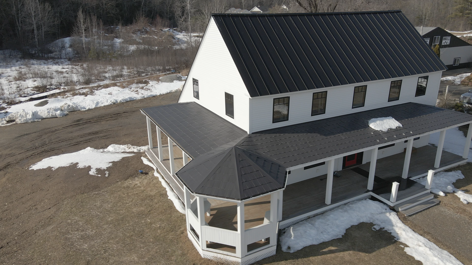 Aerial exterior view of a winter residential property