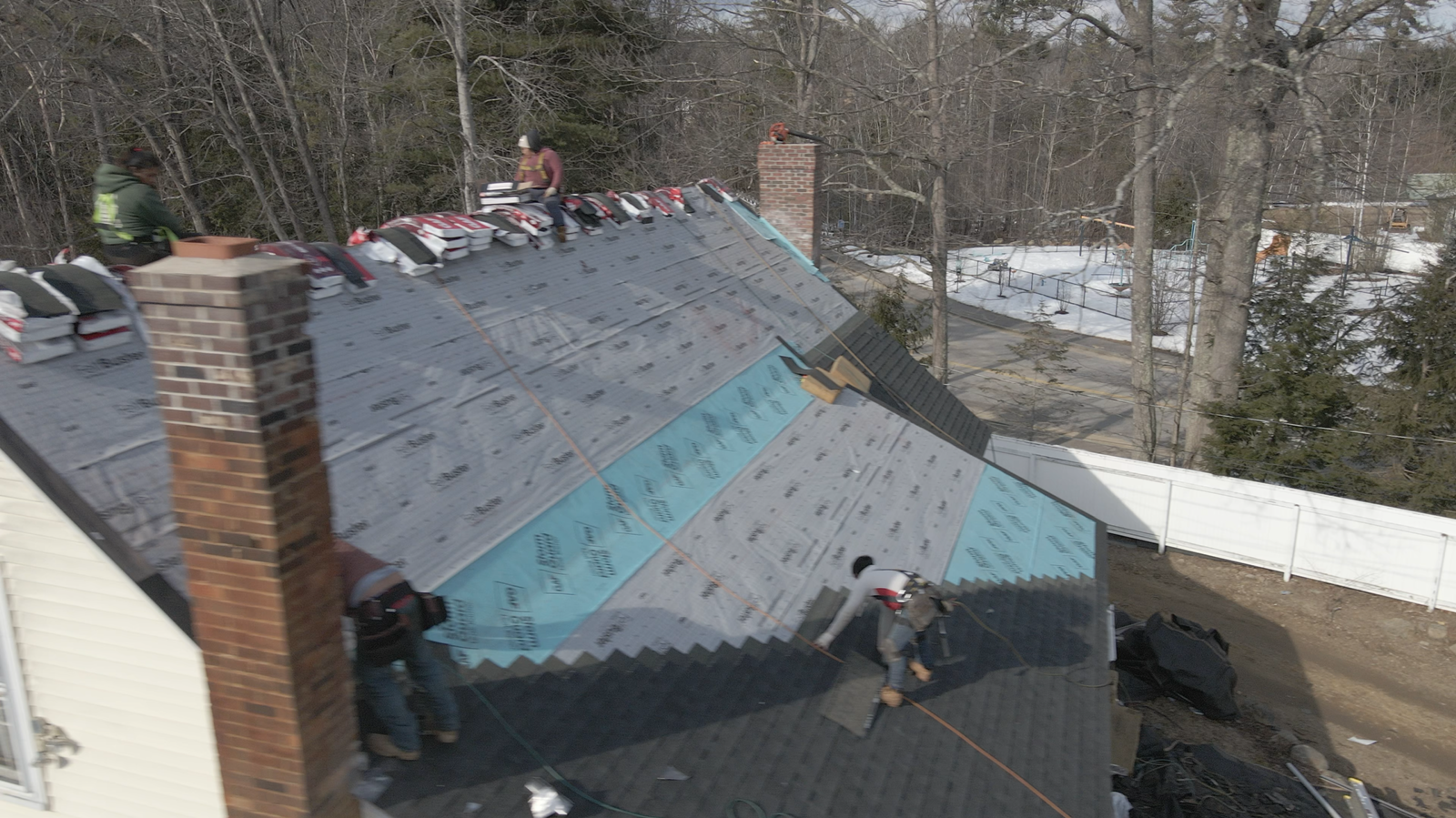 Aerial view of a roof project in progress