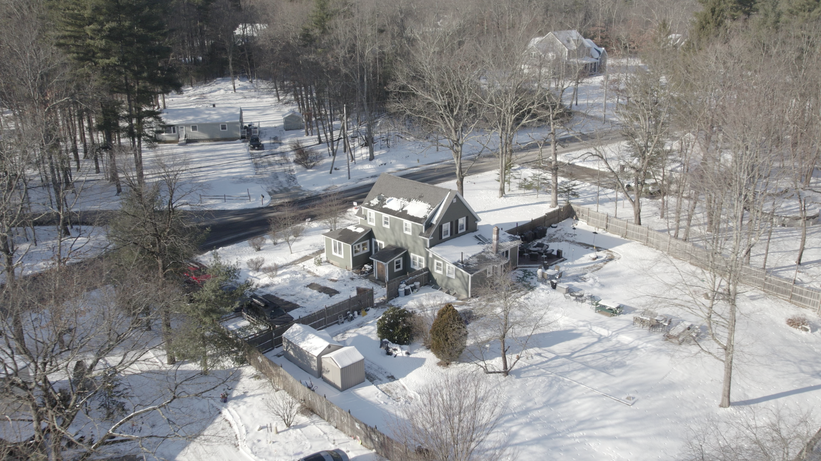 High aerial view of a snowy residential property
