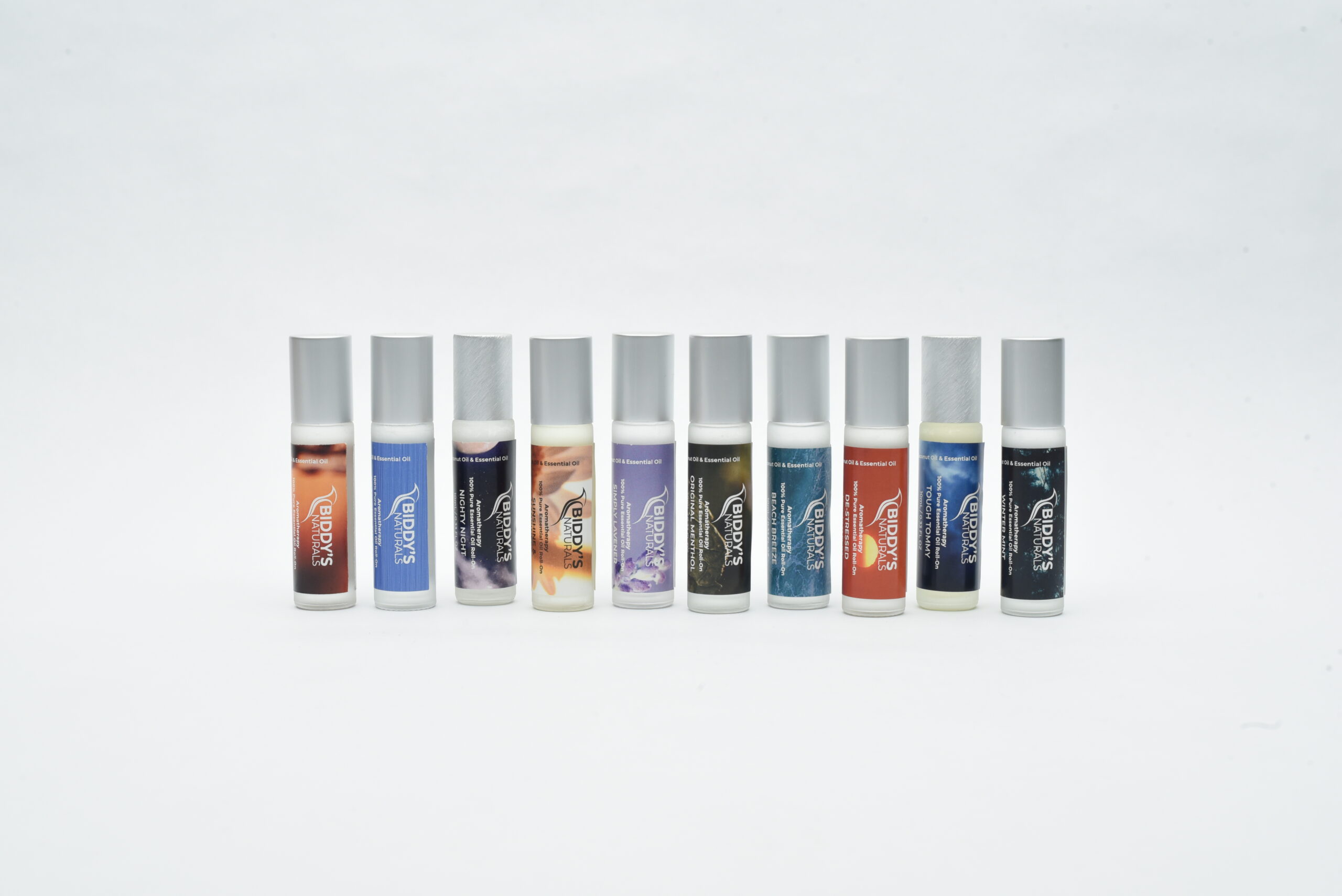 Assorted aromatherapy roll-on bottles in a row