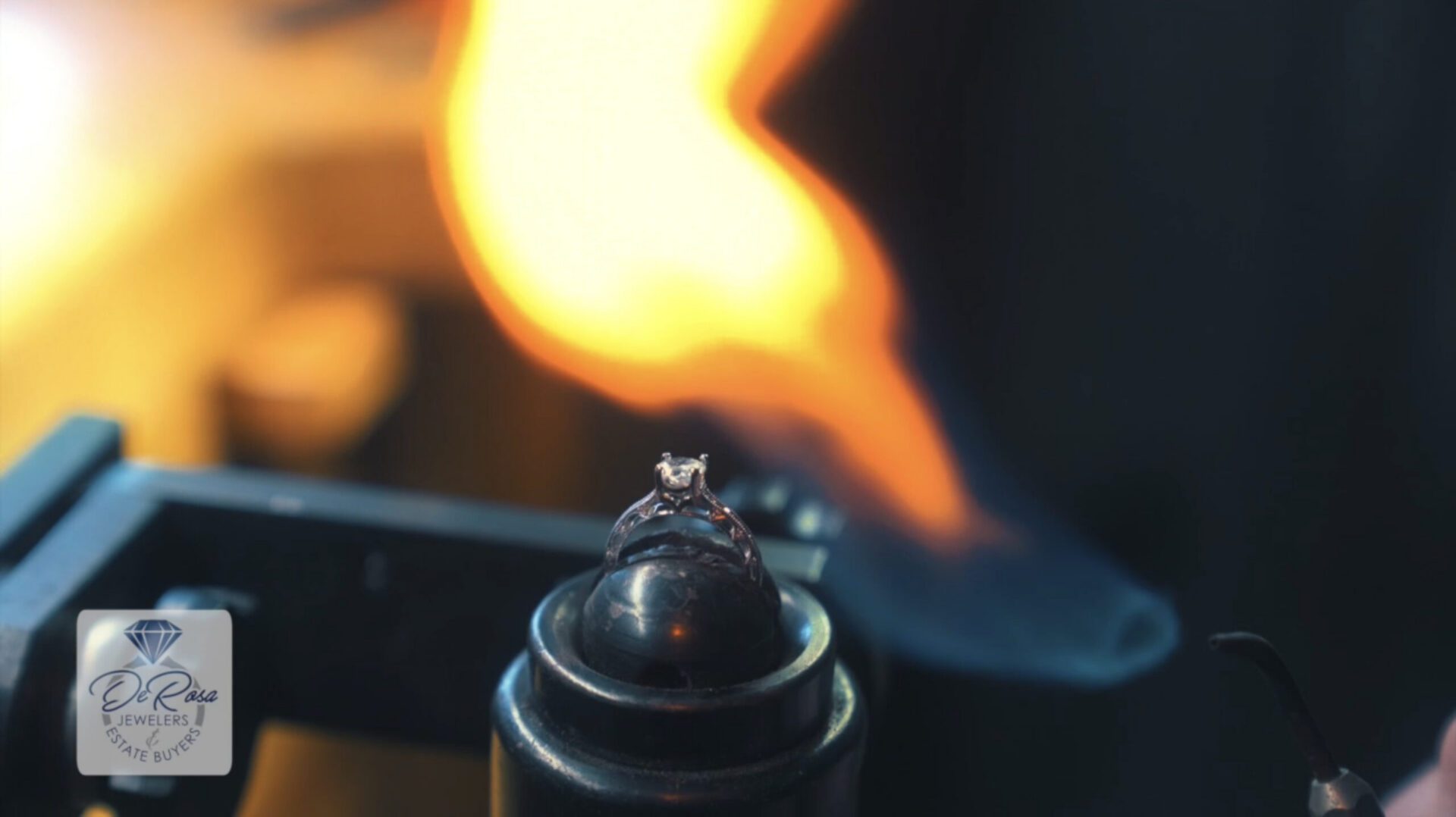 Engagement ring being heated with jeweler's torch