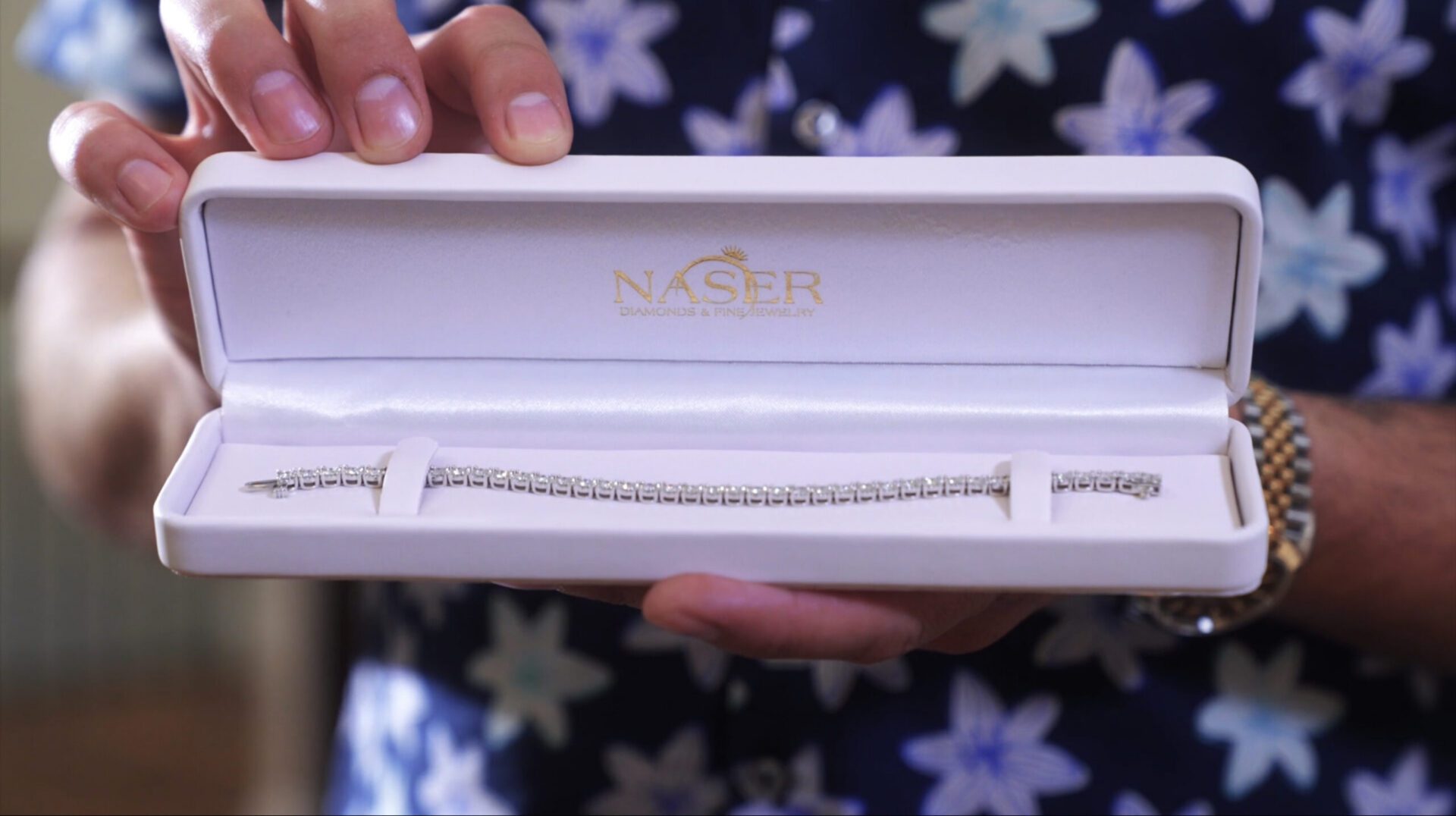 White box holding diamond tennis bracelet
