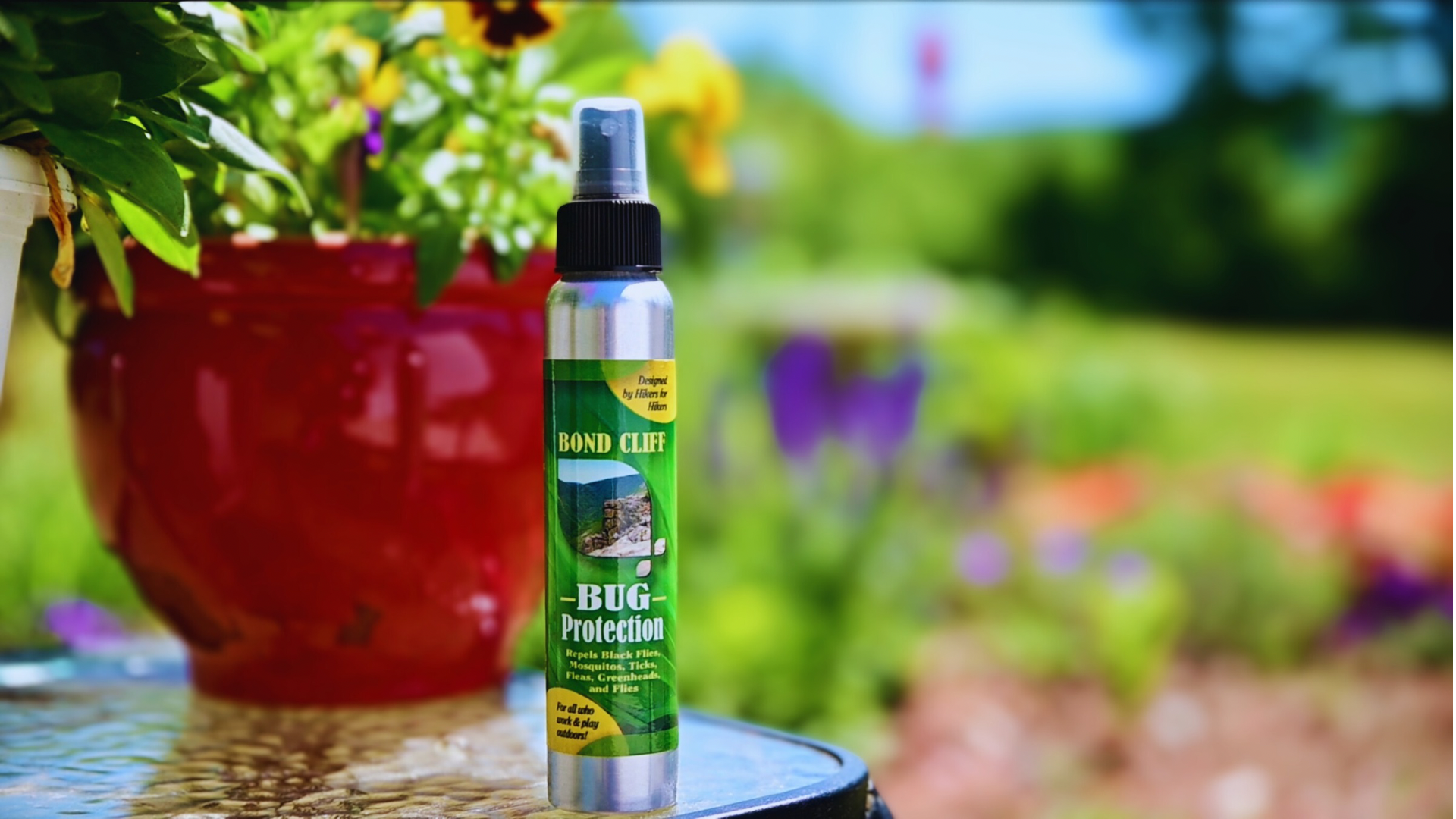 Bug protection spray bottle on outdoor table