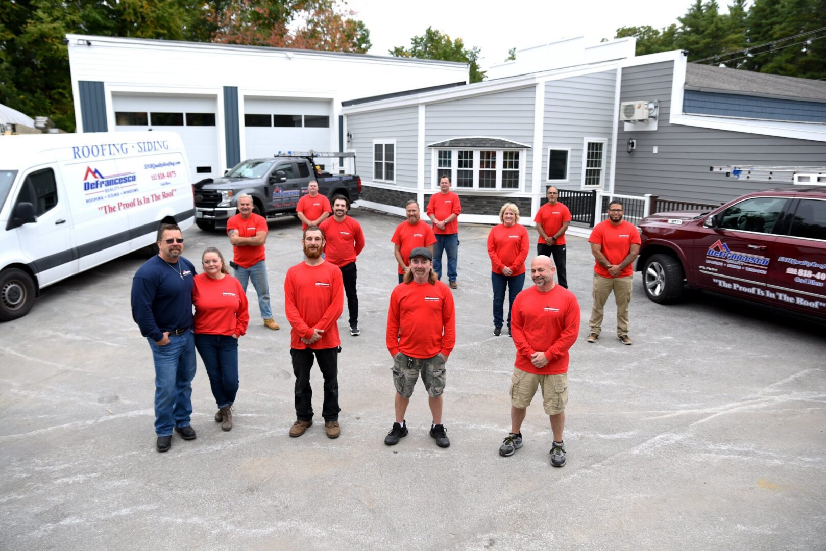 Group of people in red shirts outside.