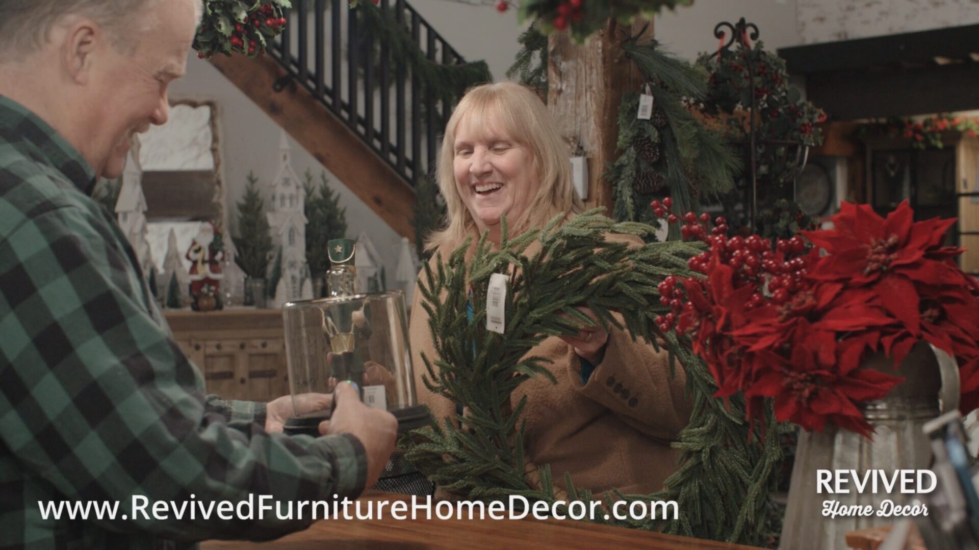 Woman shopping for holiday wreaths and decor.