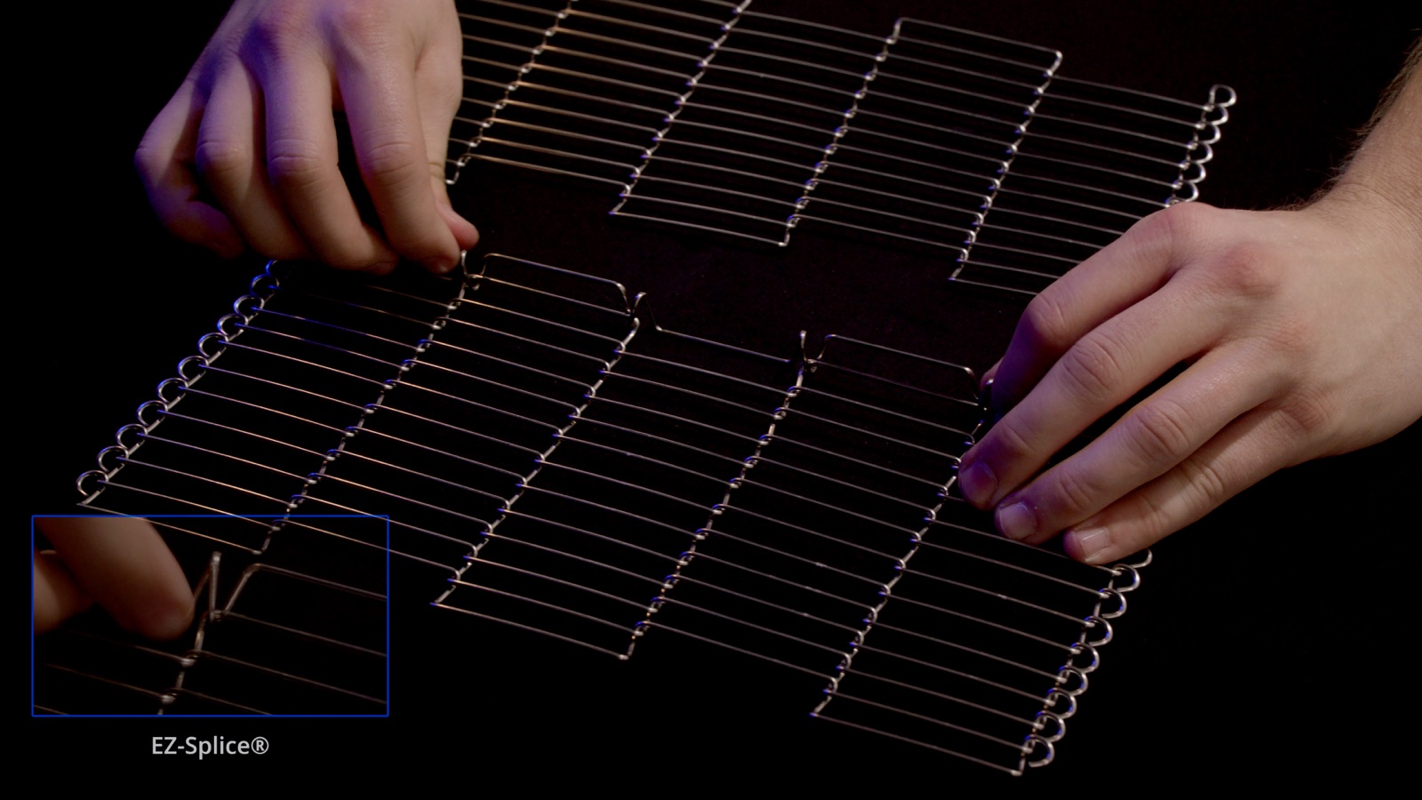 Hands arranging two wire belt sections — Wire Belt Company of America