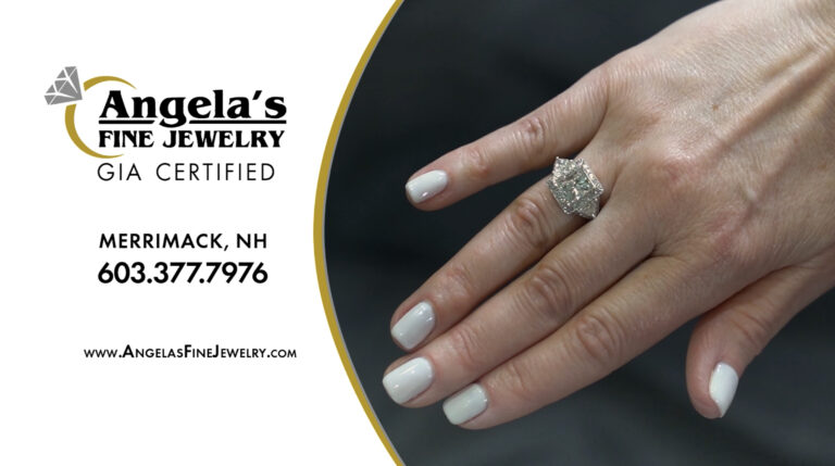 Hand wearing a diamond ring, contact information.